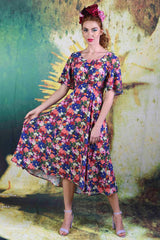 Model wearing the Annah Stretton Down The Line dress in Echinacea