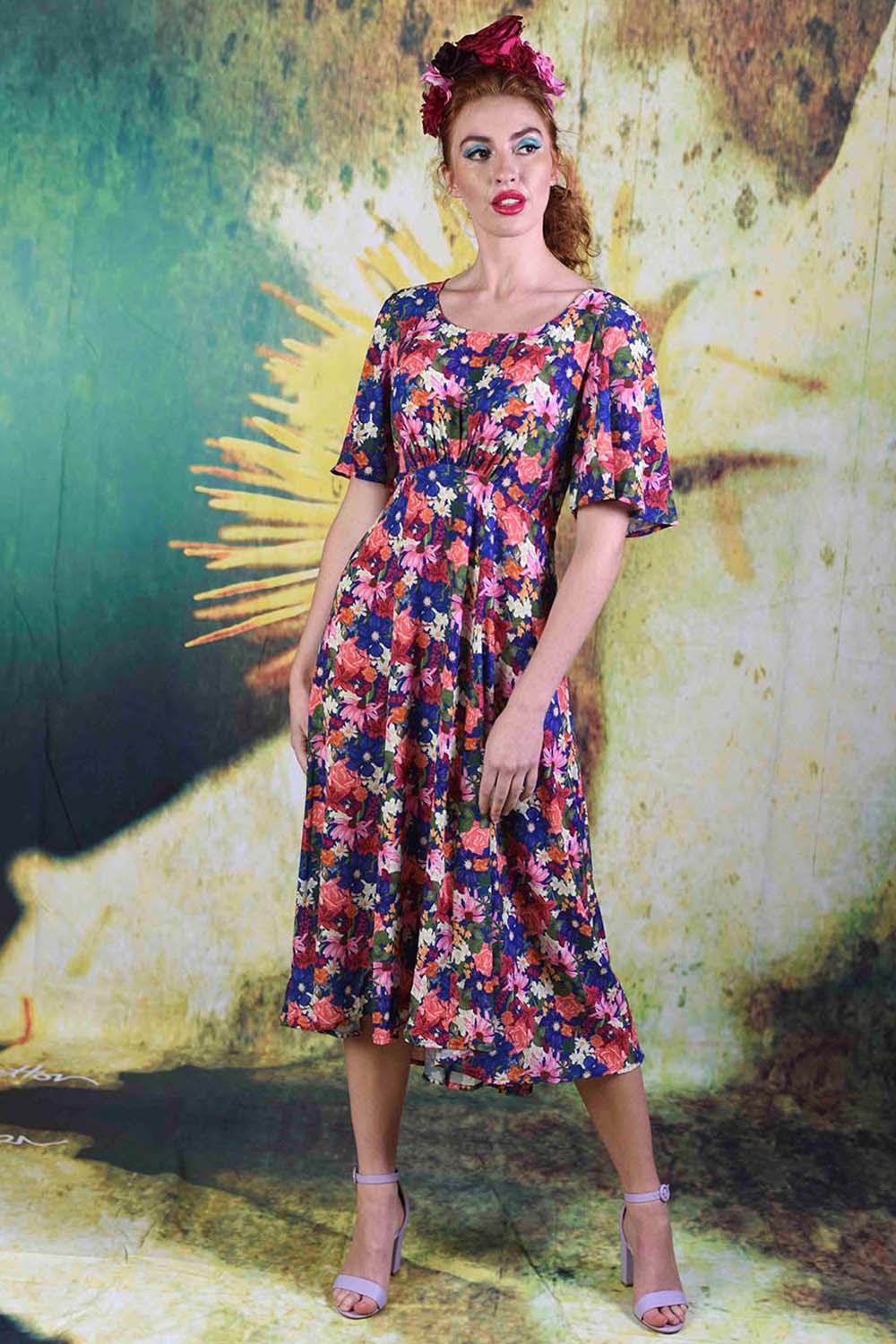 Model wearing the Echinacea Down the Line dress by Annah Stretton