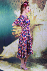 Side of model wearing the Annah Stretton Down the Line dress in echinacea