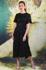 Model wearing the Fabia Dress in Black by Annah Stretton