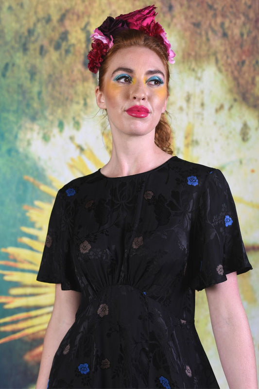 Close-up of model wearing the Annah Stretton Fabia dress in Black