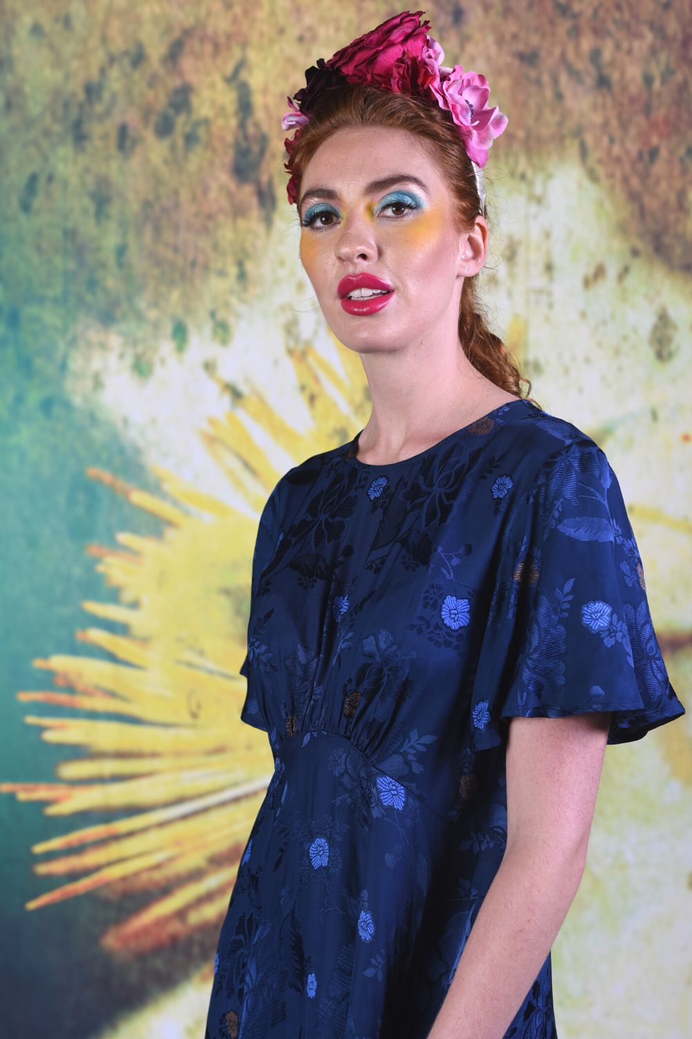 Close-up of model wearing the Annah Stretton  Fabia Dress in Ocean Blue