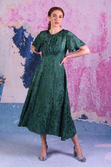 model wearing fabia emerald dress