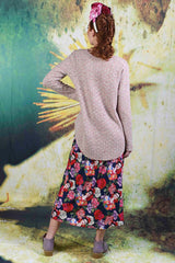 Back of model wearing the Gretel Grace knit in creme