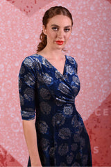 model wearing jude jade velvet blue peony dress