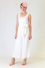 lucy lana jumpsuit in white, front view with flower hair clip