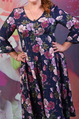 Closer shot of pink and purple lillies on a navy background on the Annah Stretton Magic Lily Dress