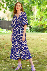 model wearing marshy may navy spot dress