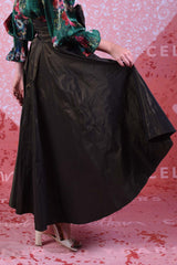Model showing flow of fabric on the Annah Stretton Miriam Max skirt in gold