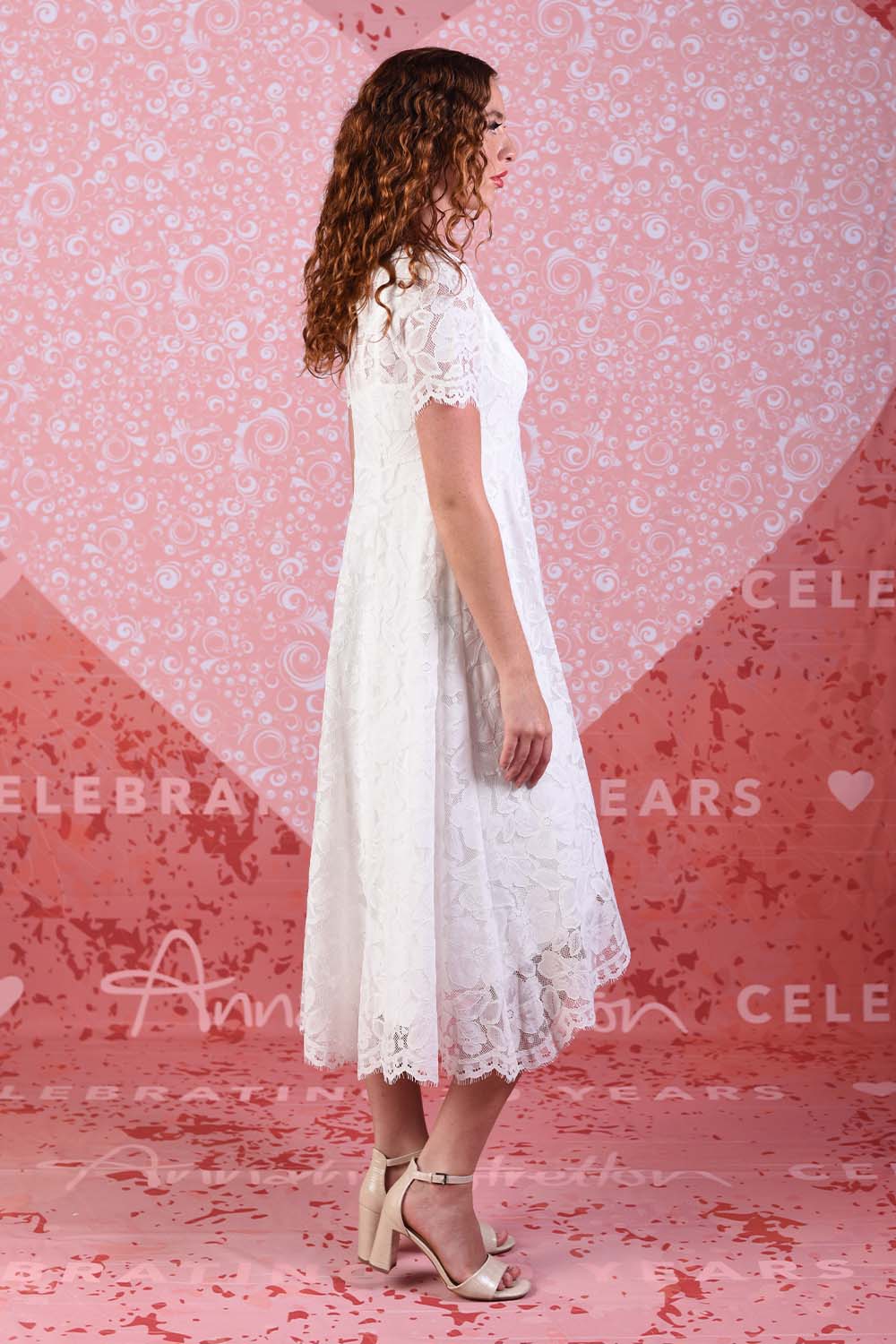 model wearing light ivory dress with slip