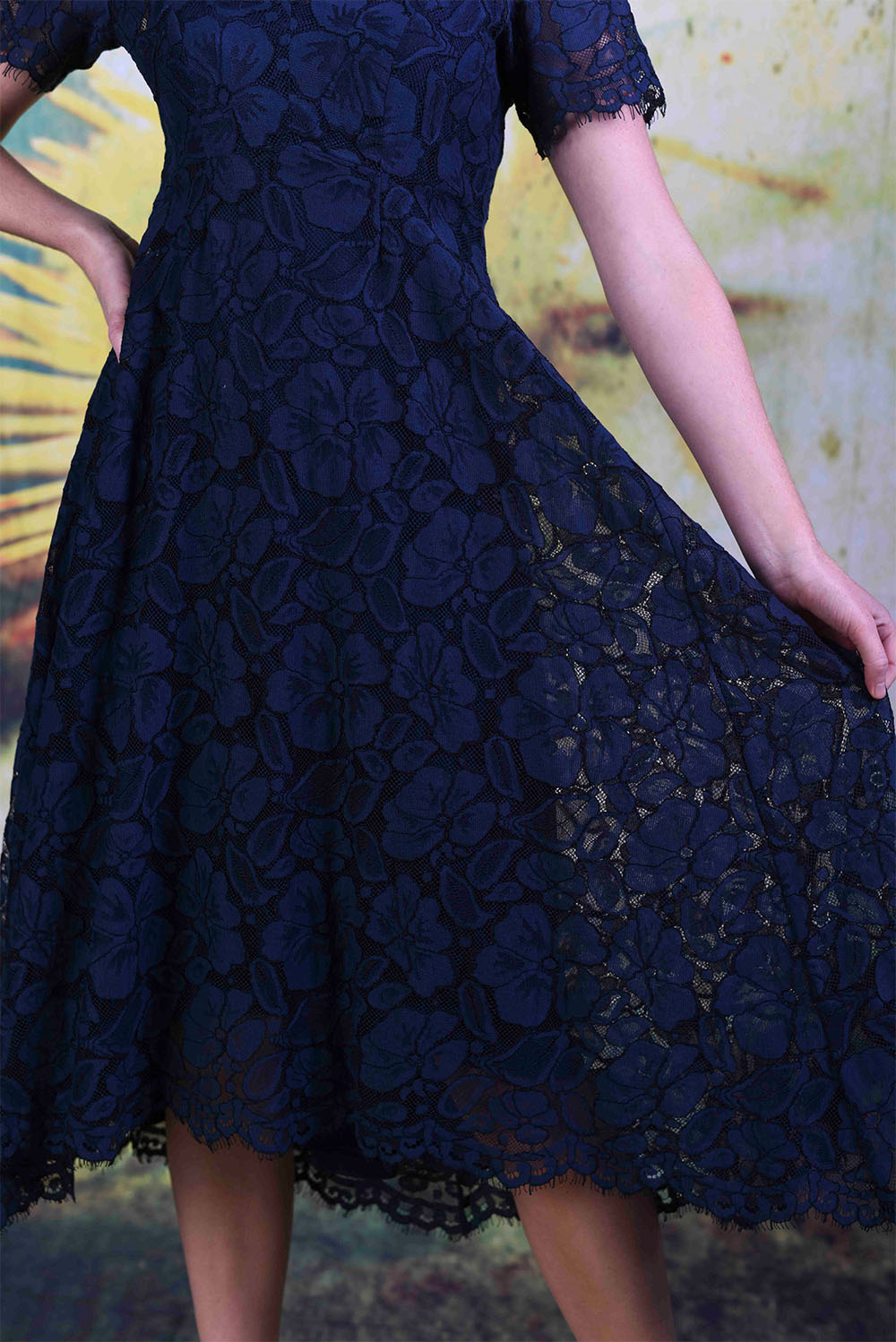 Close-up of navy lace fabric of the Annah Stretton Moonlight Dress