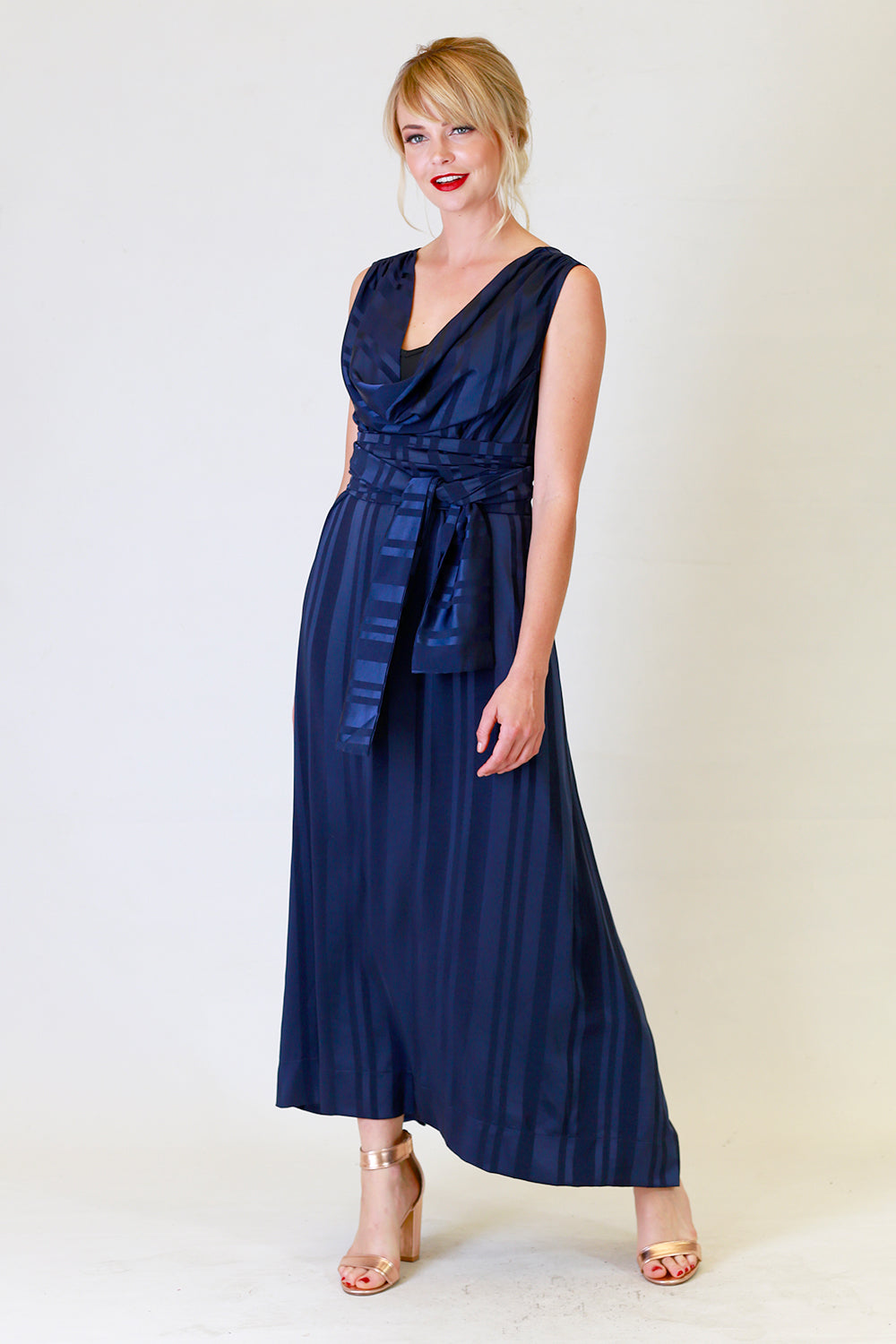 myra may dress in blue with stripe detail, front view