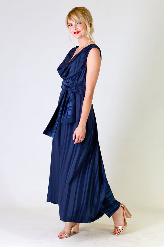 myra may dress in blue with stripe detail, side view