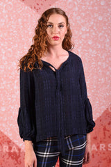 model wearing poison navy ivy top
