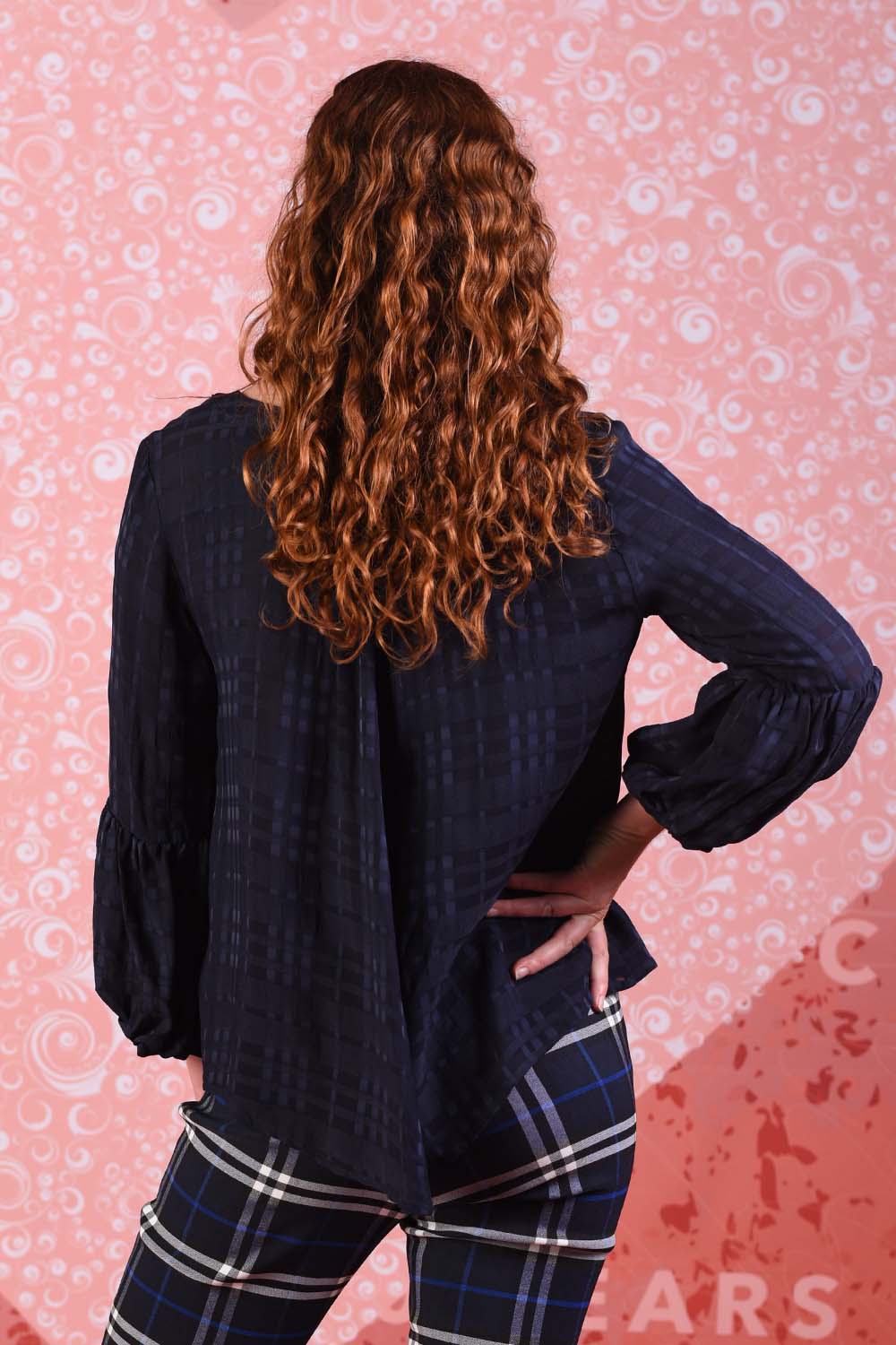 model wearing poison navy ivy top