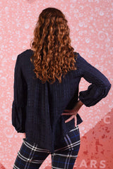 model wearing poison navy ivy top