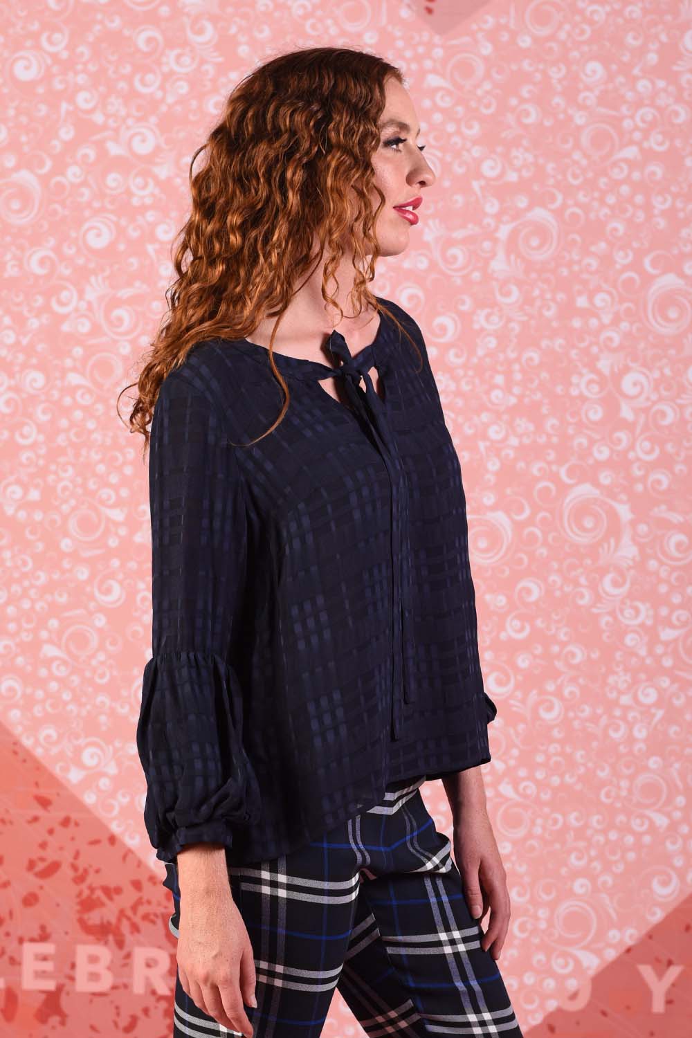 model wearing poison navy ivy top