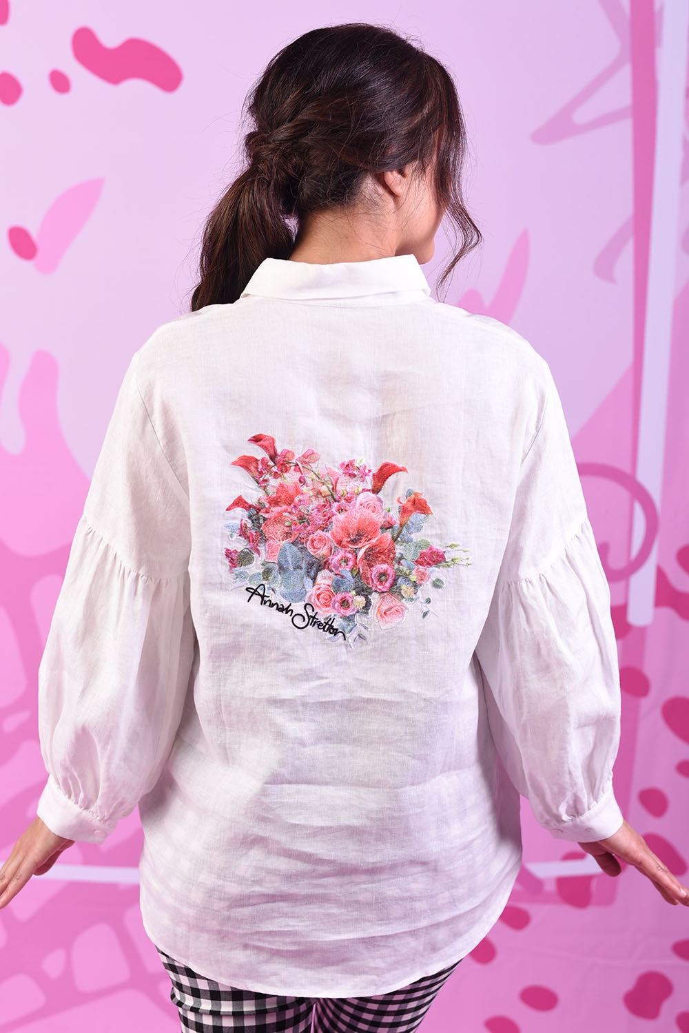 Back of Model wearing Popo Linen shirt with embroidery by Annah Stretton