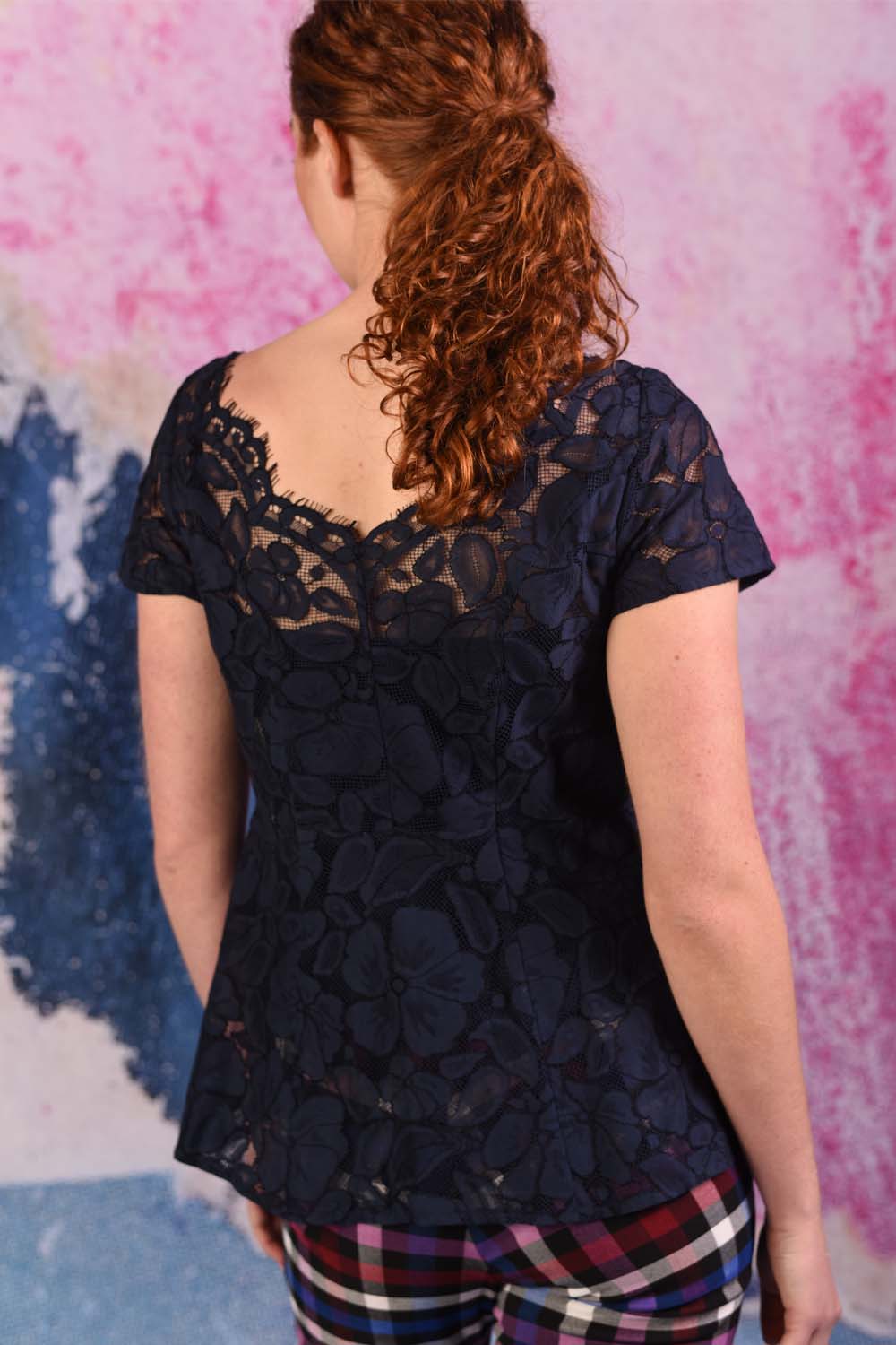 model wearing poppy posey navy top