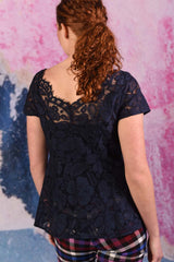 model wearing poppy posey navy top