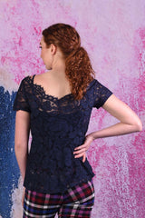 model wearing poppy posey navy top