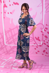 Model wearing primrose dress in navy by Annah Stretton