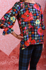 model wearing sunny silky red poppy top