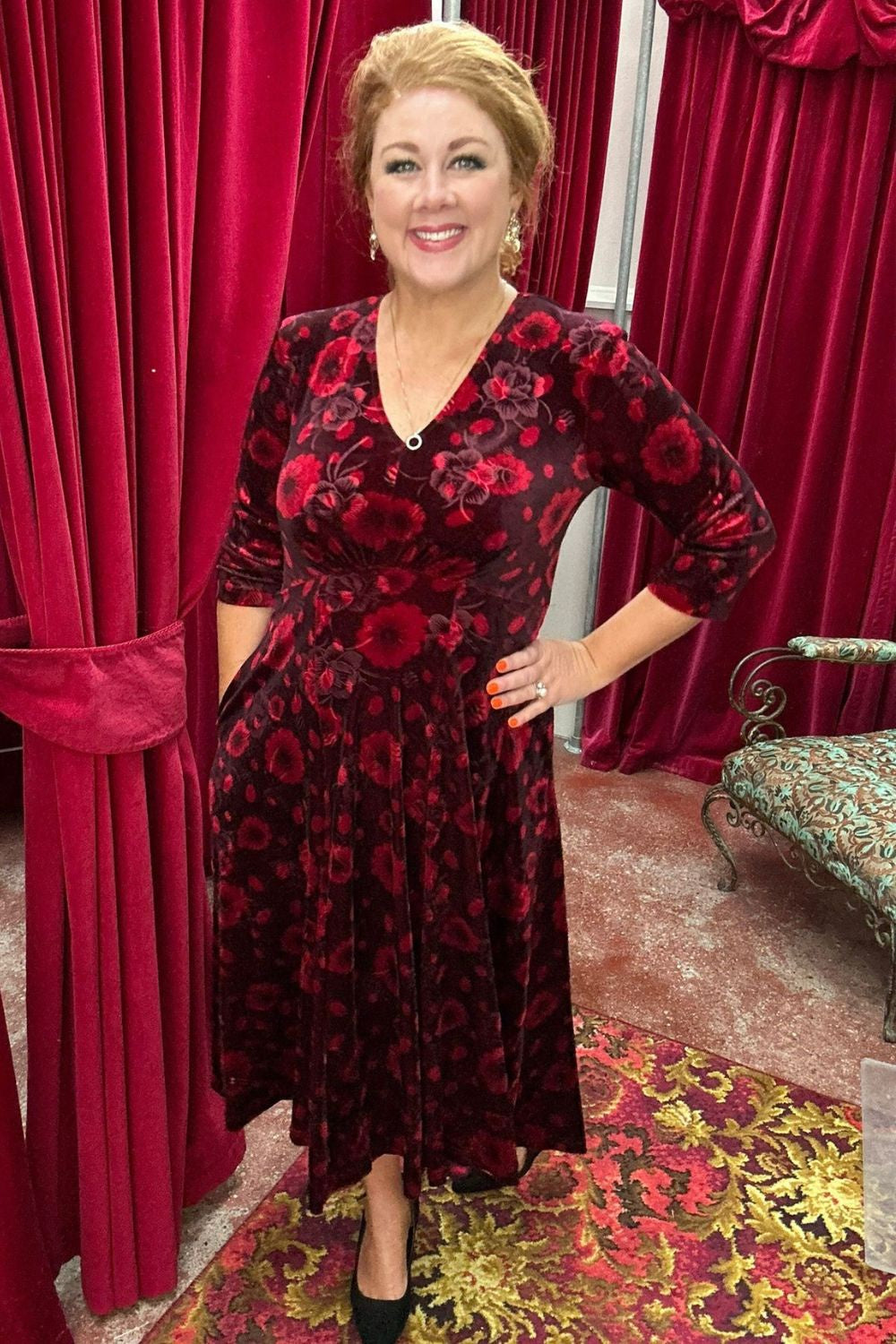 Model wearing the Veronica Jude Dress in red floral spot, by Annah Stretton