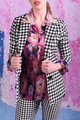 model wearing winn check jacket with posy floral top.